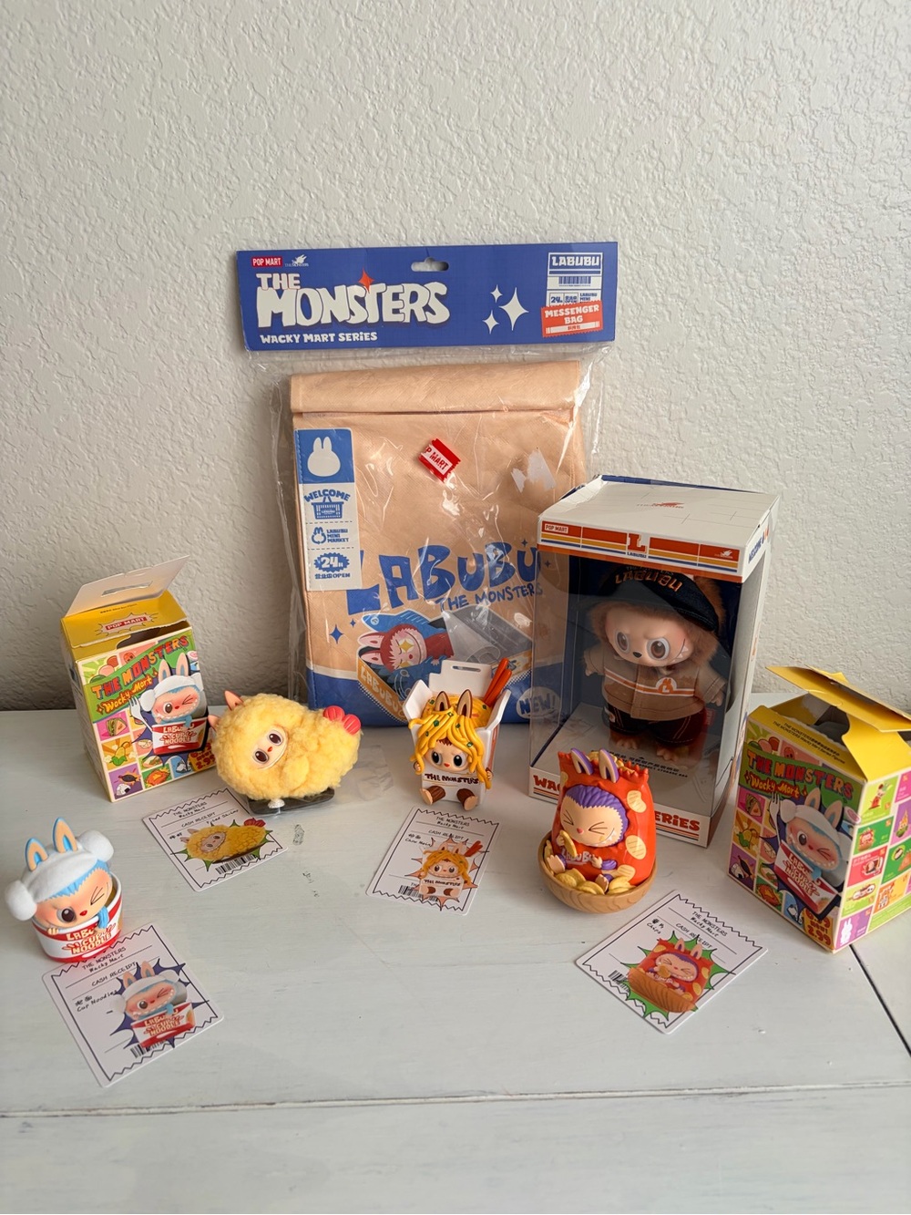 Labubu Wacky Mart Series Cashier, Messenger Bag and 4 confirmed figurines.